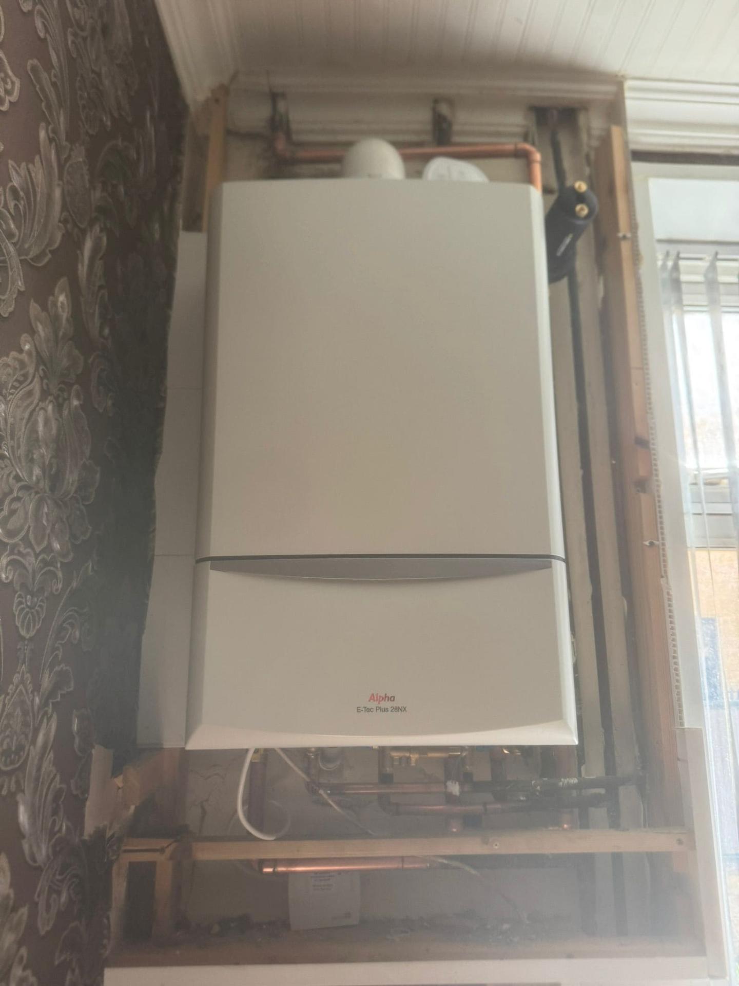 Alpha E-Tec boiler replacement installation with neat copper pipework