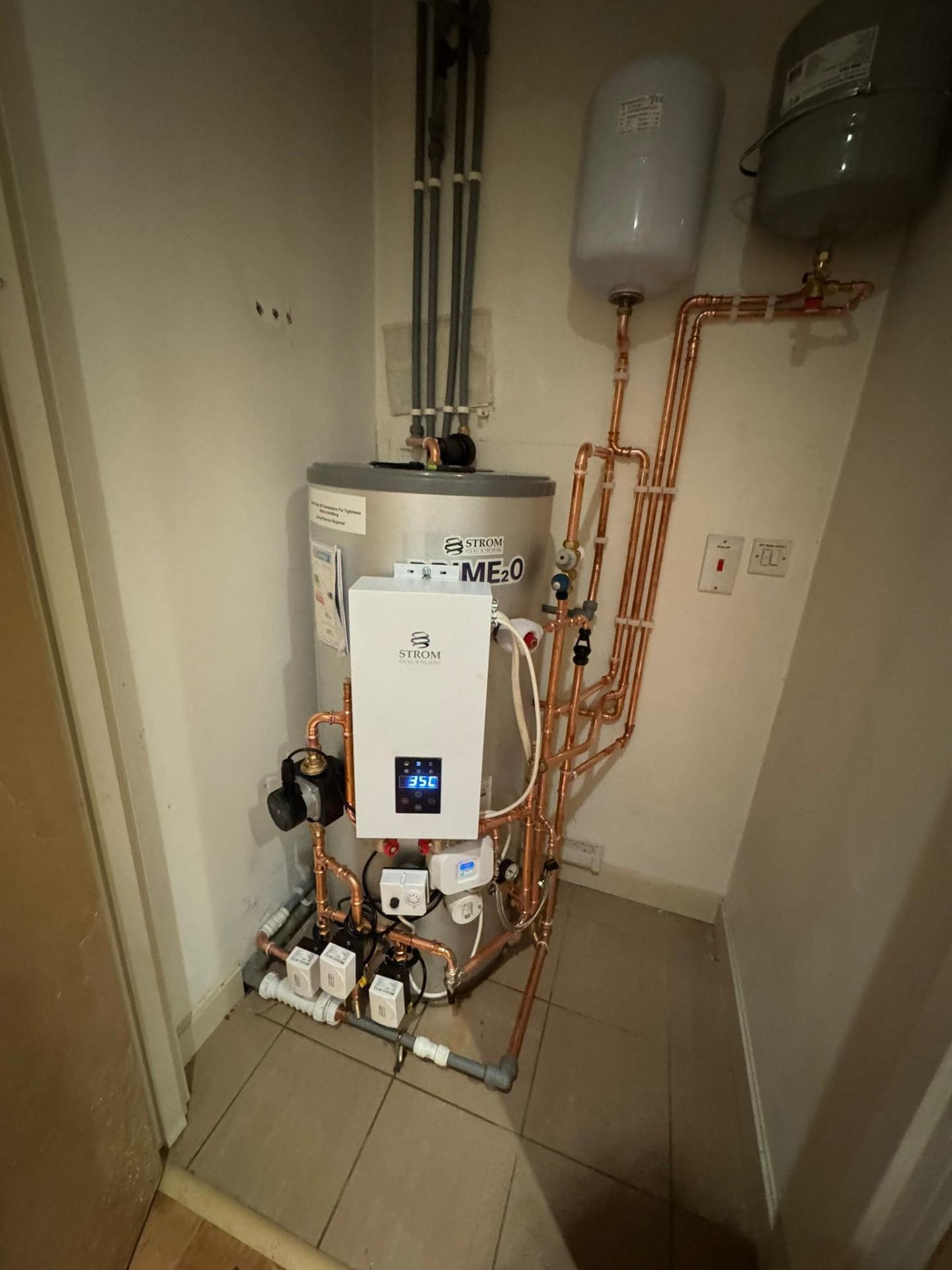 Complete central heating system installation with unvented cylinder and controls