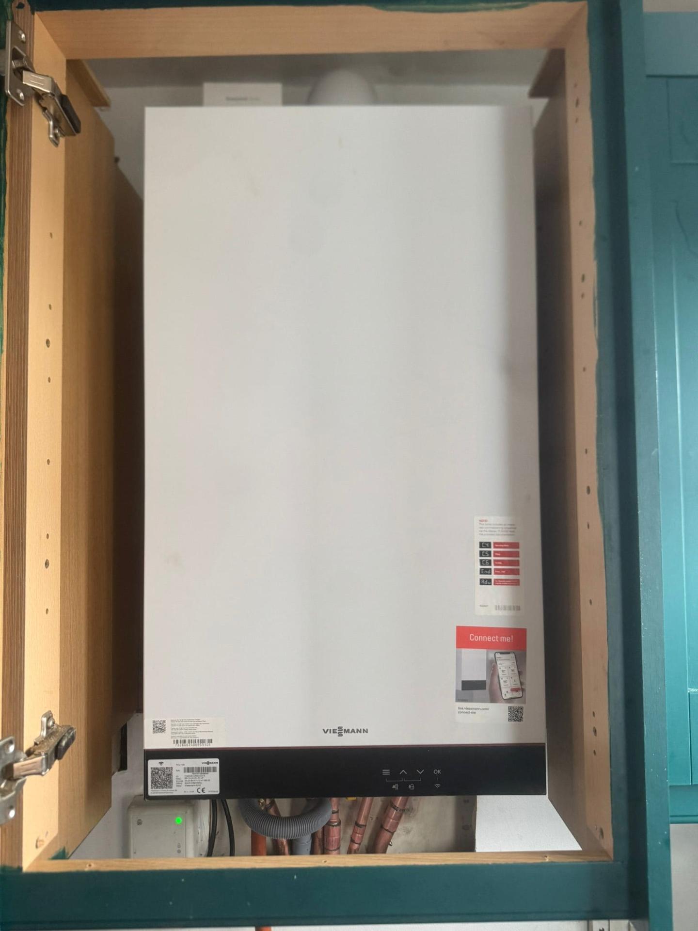 Viessmann boiler replacement fitted inside airing cupboard by Central One